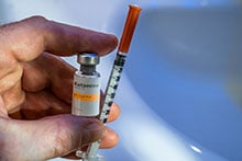 Ketamine Injection Vial With Syringe in hand
