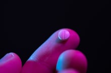pill_finger_iStock-1159196366
