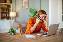 woman_upset_phone_iStock-2207236279